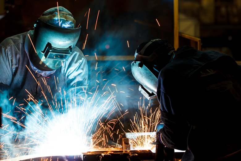 two welders in action