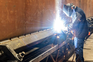 man welding positioner