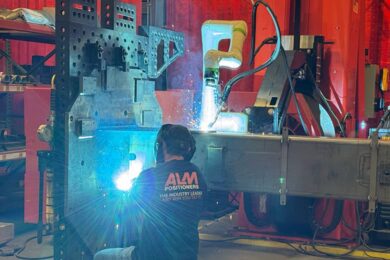 A welder working alongside a COBOT.